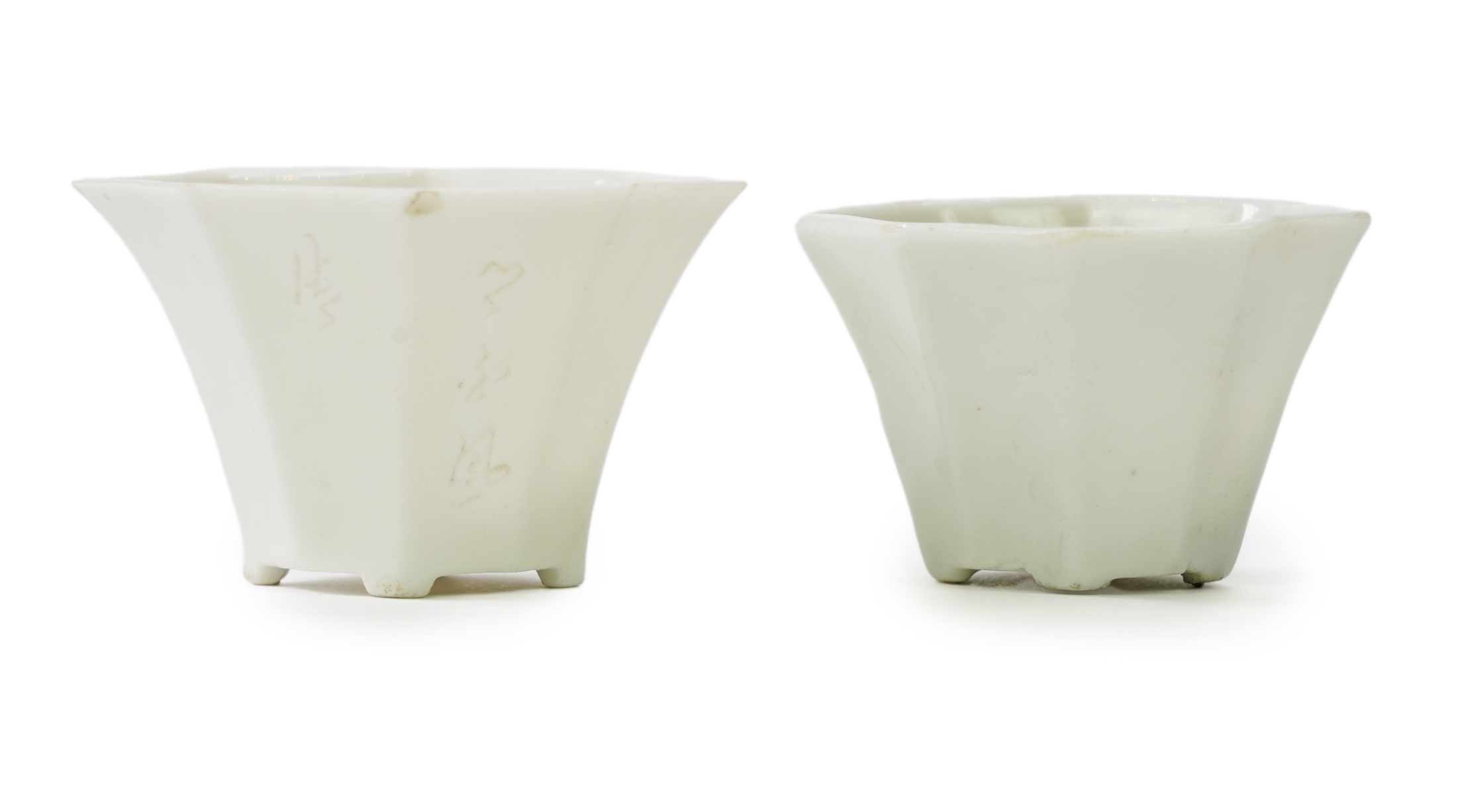 Two Chinese Dehua blanc de chine octagonal cups, Kangxi period